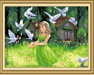 Lovely Girl with Beautiful Pigeons in the Green Fields